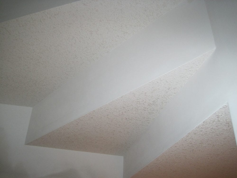 Completed stairwell with popcorn ceiling